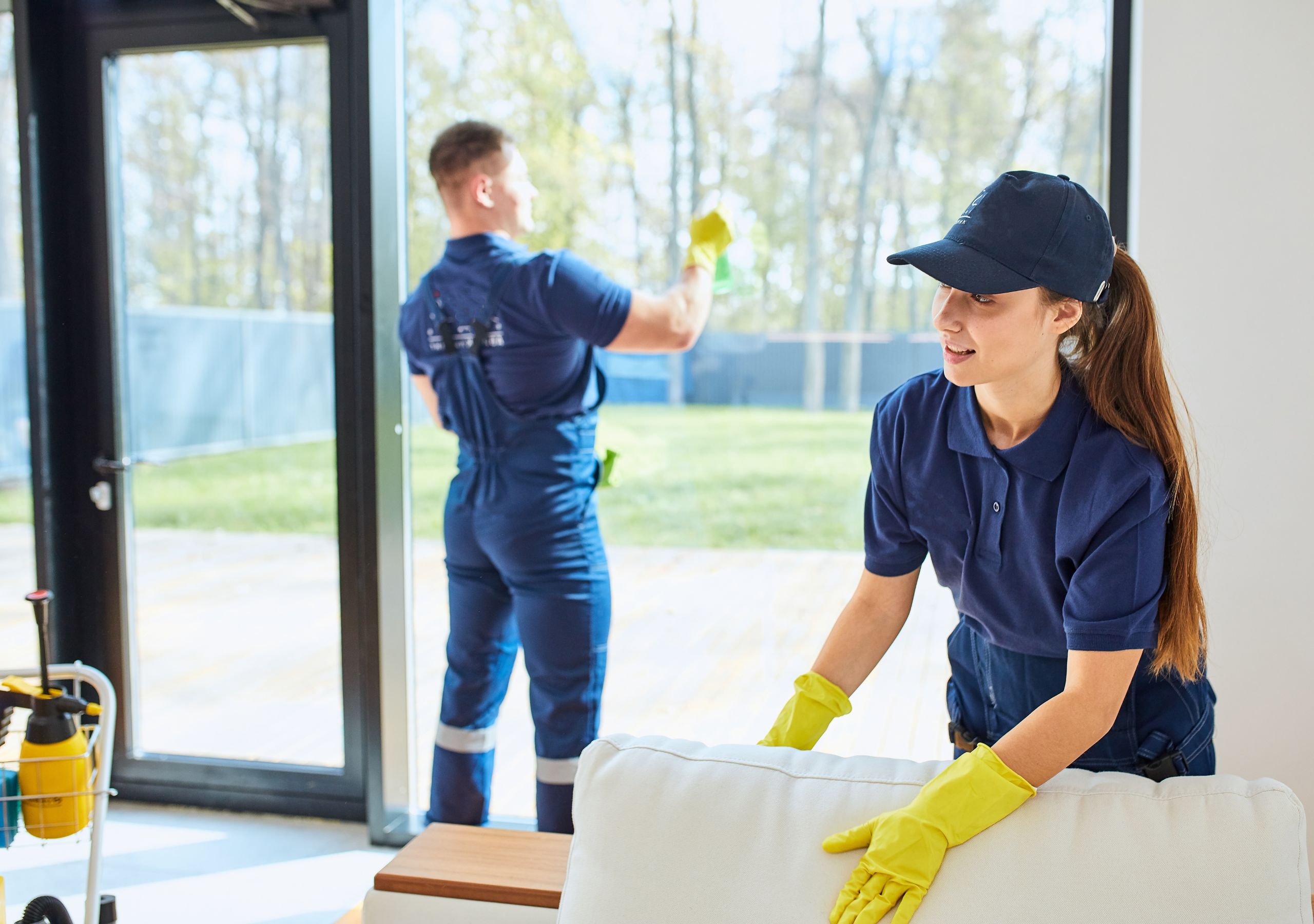 male and female cleaners doing house cleaning in lisbon